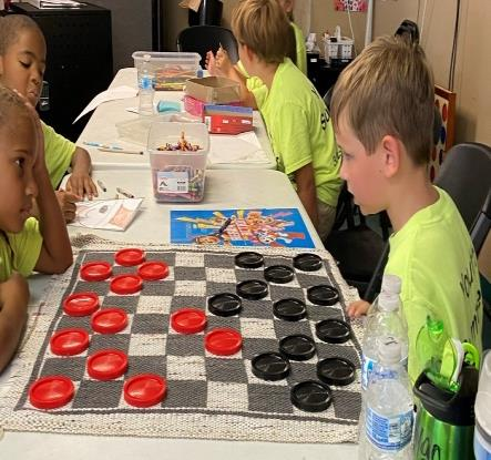 Summer school playing checkers